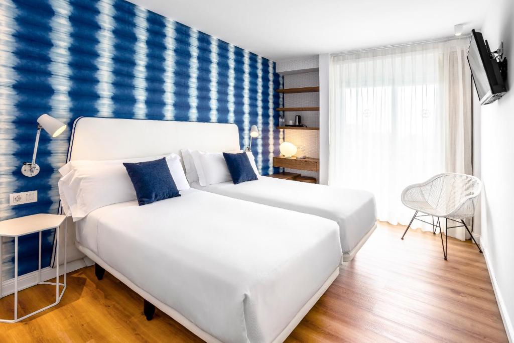 Postel nebo postele na pokoji v ubytování Hotel Anabel