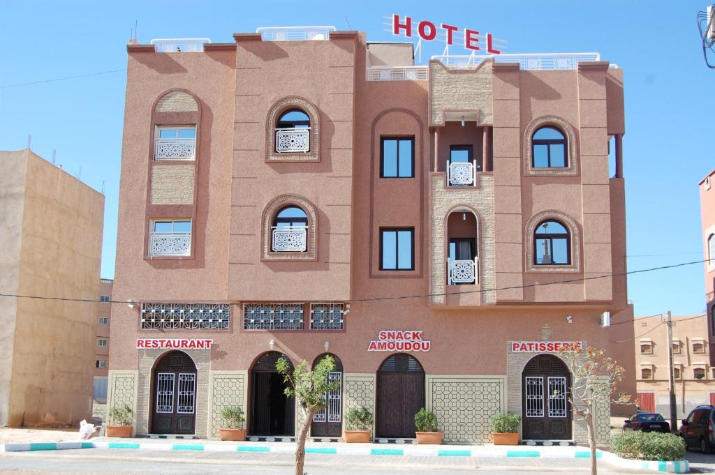 a building with a hotel on the side of it at Hotel AMOUDOU فندق أمودو in Tiznit
