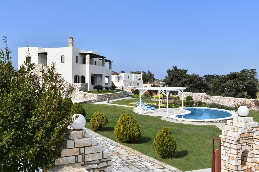 a view of a villa with a swimming pool at Villa Trifylia in Parikia