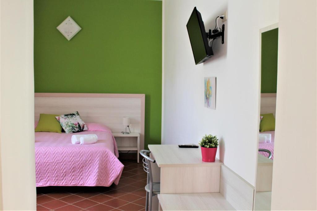 Postel nebo postele na pokoji v ubytování Pompei Hostel Deluxe