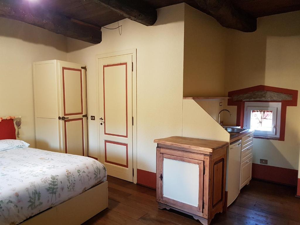 Postel nebo postele na pokoji v ubytování B&B La Cascina di Monia e Mario