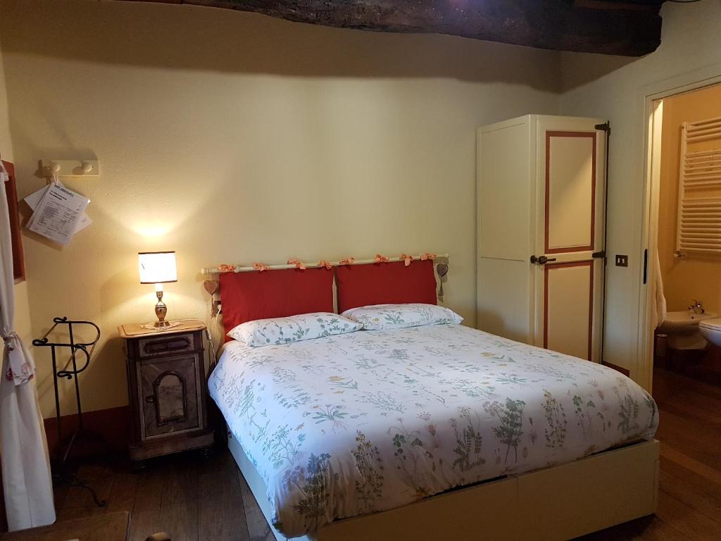 Postel nebo postele na pokoji v ubytování B&B La Cascina di Monia e Mario