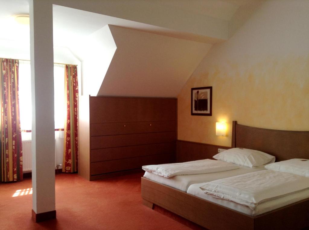 Postel nebo postele na pokoji v ubytování 1A Landhotel Schicklberg