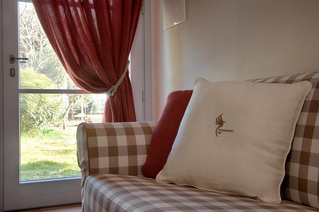 Postel nebo postele na pokoji v ubytování Agriturismo Poderedodici