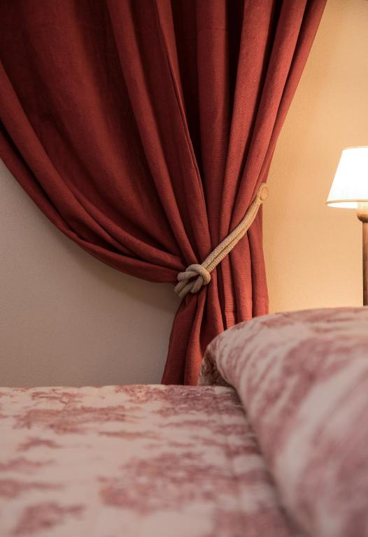 Postel nebo postele na pokoji v ubytování Agriturismo Poderedodici