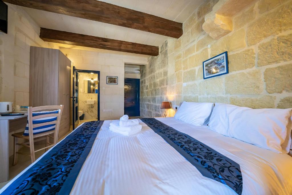 Postel nebo postele na pokoji v ubytování Ta Pinu Guesthouse