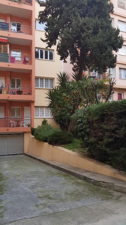 a parking lot in front of a building at location saisonnière in Menton