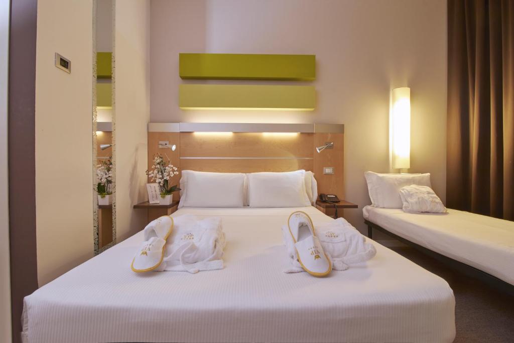 Postel nebo postele na pokoji v ubytování iH Hotels Milano Gioia