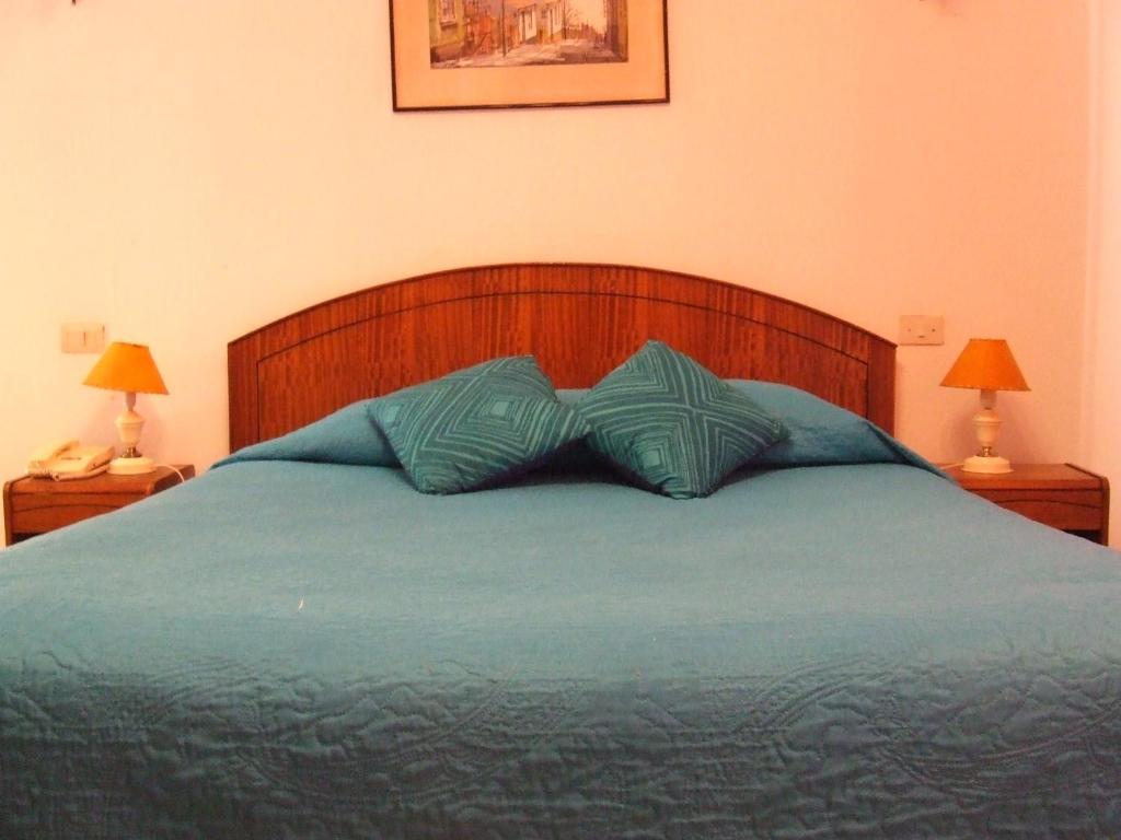 Postel nebo postele na pokoji v ubytování Hotel Balia Casino