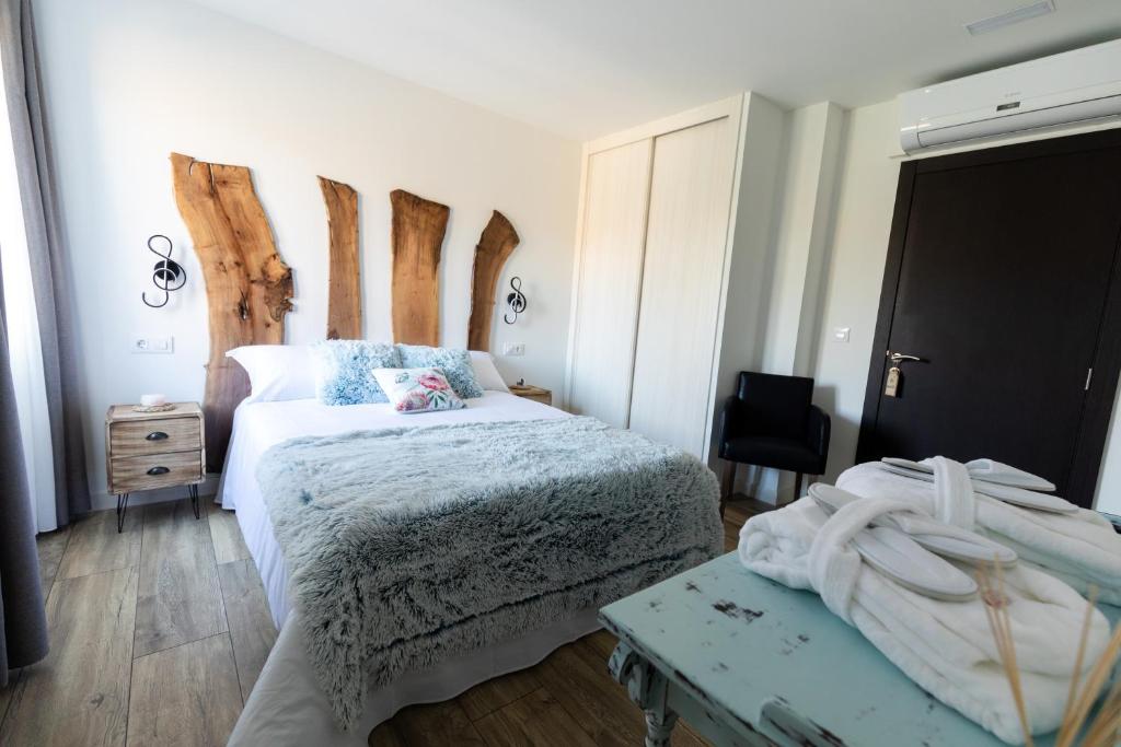 Postel nebo postele na pokoji v ubytování Hotel rural Finca Vivaldi Nature & Spa