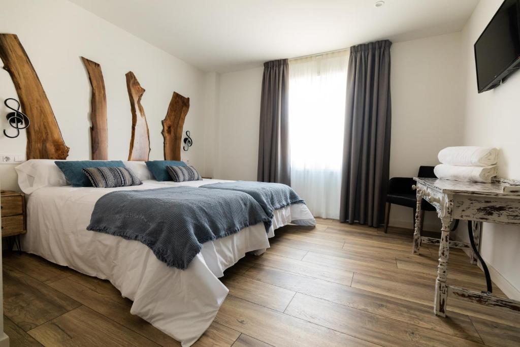 Postel nebo postele na pokoji v ubytování Hotel rural Finca Vivaldi Nature & Spa