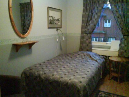 Postel nebo postele na pokoji v ubytování Målilla Hotell & Restaurang