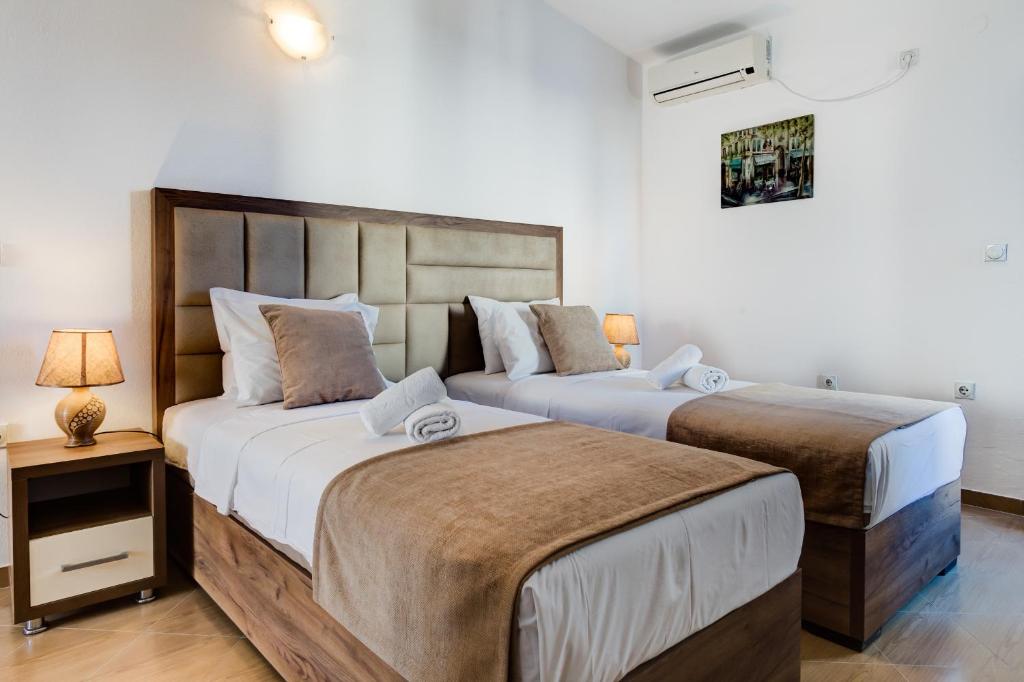 Postel nebo postele na pokoji v ubytování Hotel Zan