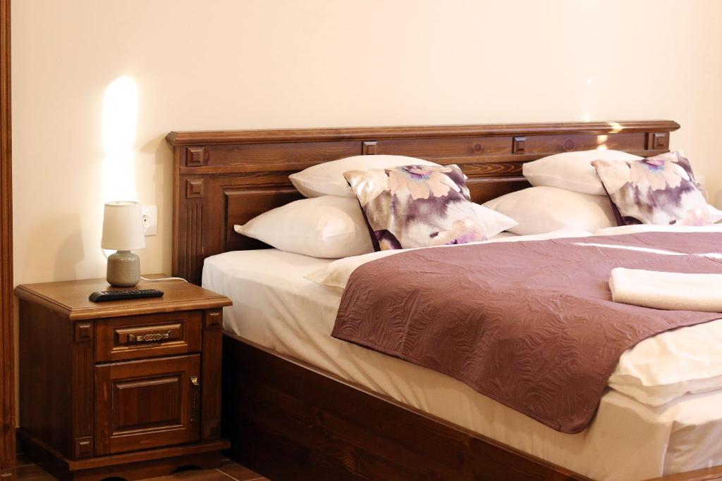 Posteľ alebo postele v izbe v ubytovaní Toscana Apartman