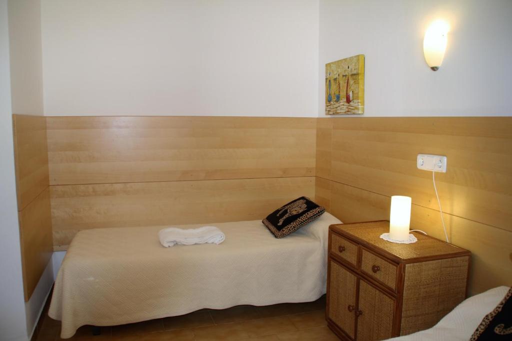 Postel nebo postele na pokoji v ubytování Apartaments Margarita Sabina Pinell