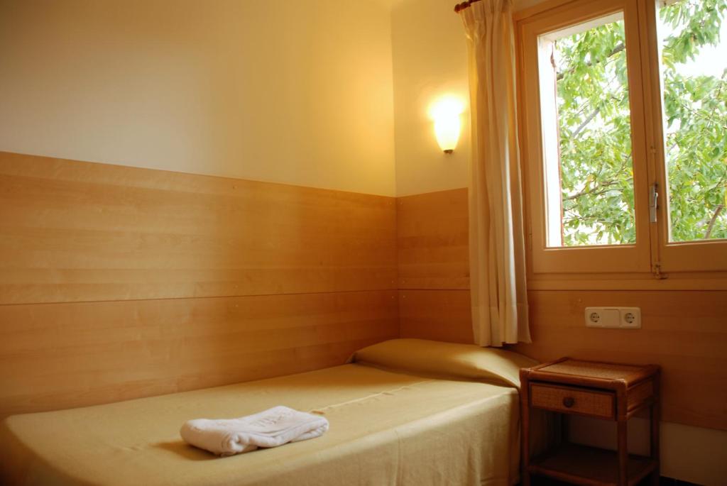 Postel nebo postele na pokoji v ubytování Apartaments Margarita Sabina Pinell
