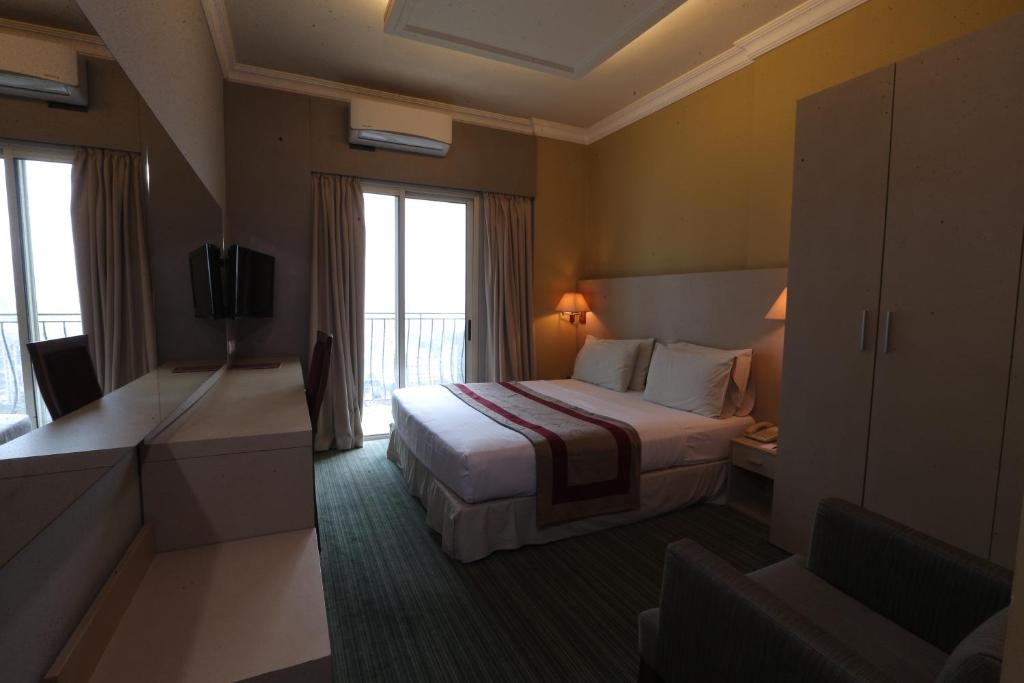 Postel nebo postele na pokoji v ubytování Padova Hotel