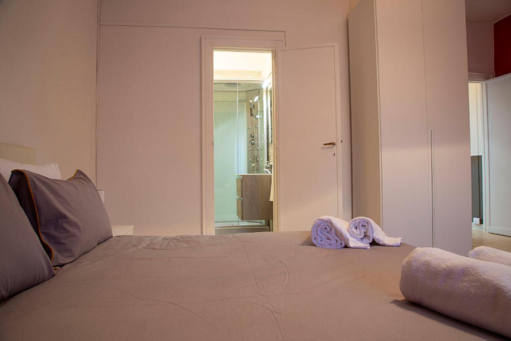 Łóżko lub łóżka w pokoju w obiekcie San Silverio Luxury House