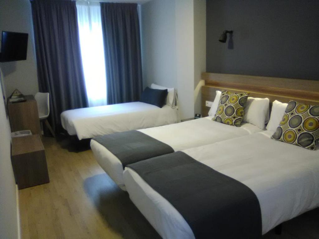 Cama o camas de una habitación en Hotel Alda Estación Pontevedra