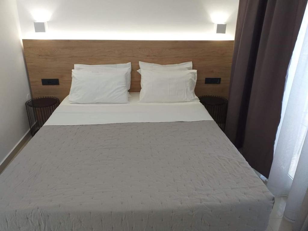 Postel nebo postele na pokoji v ubytování Aestas Apartments