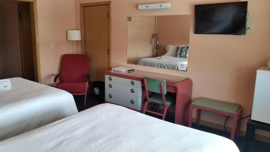 Postel nebo postele na pokoji v ubytování Holiday Music Motel