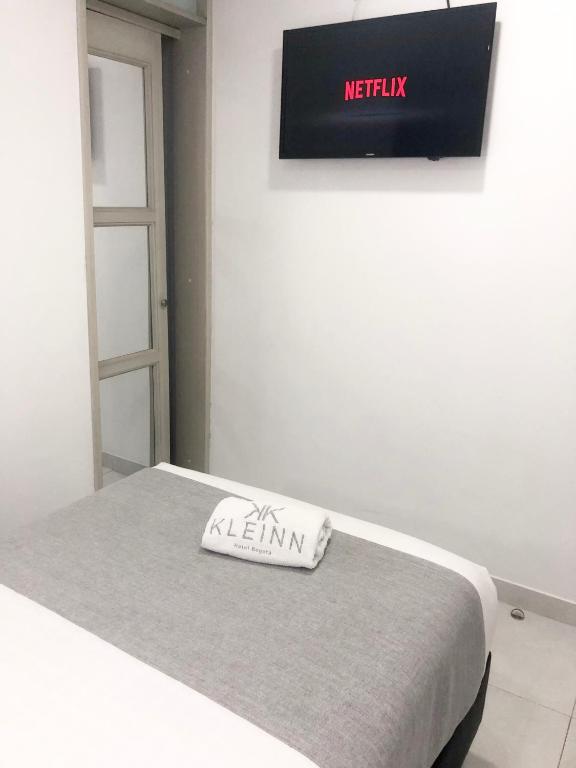Postel nebo postele na pokoji v ubytování KLEINN HOTEL BOGOTÁ