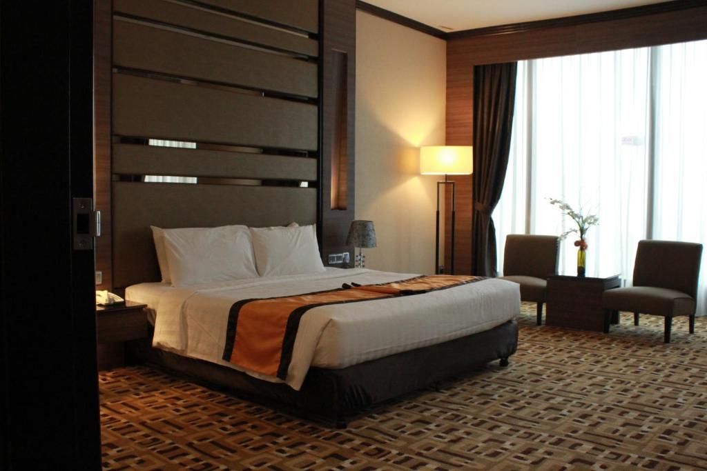 Postel nebo postele na pokoji v ubytování Grand Paragon Hotel Johor Bahru