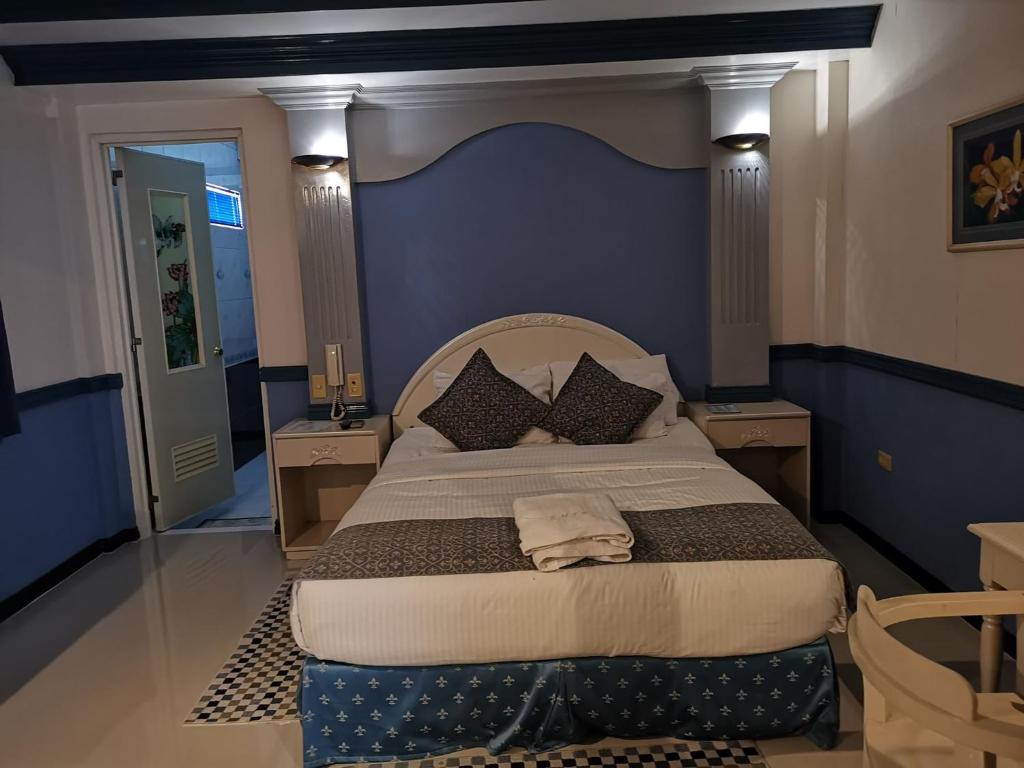 Postel nebo postele na pokoji v ubytování SM Travelodge