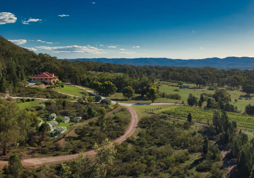 an aerial view of a farm with a house and a road at Mudgee Homestead Guesthouse in Mudgee