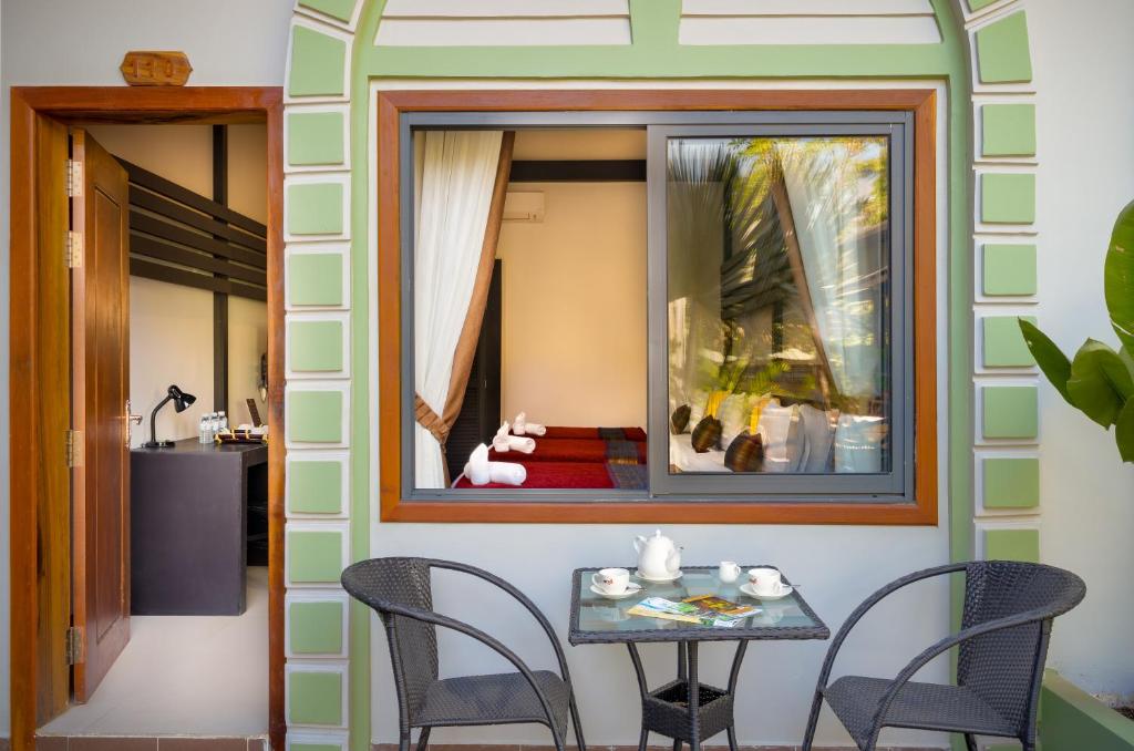 Posezení v ubytování Reveal Angkor Hotel