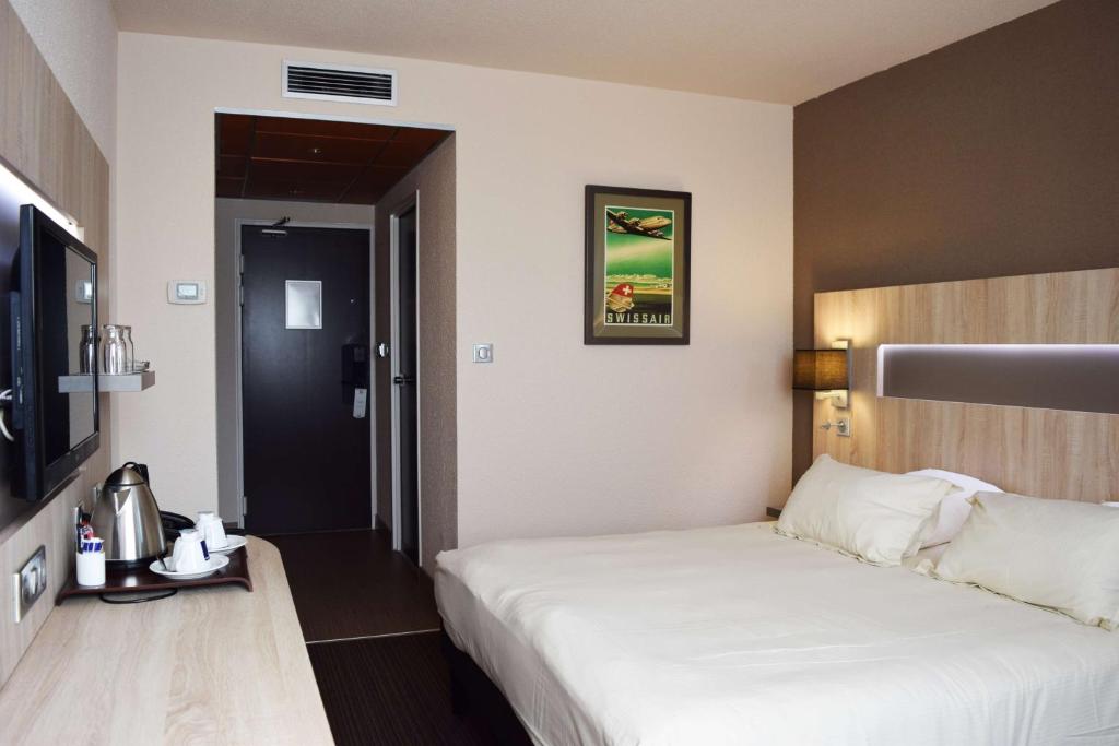 Postel nebo postele na pokoji v ubytování Best Western Marseille Aeroport