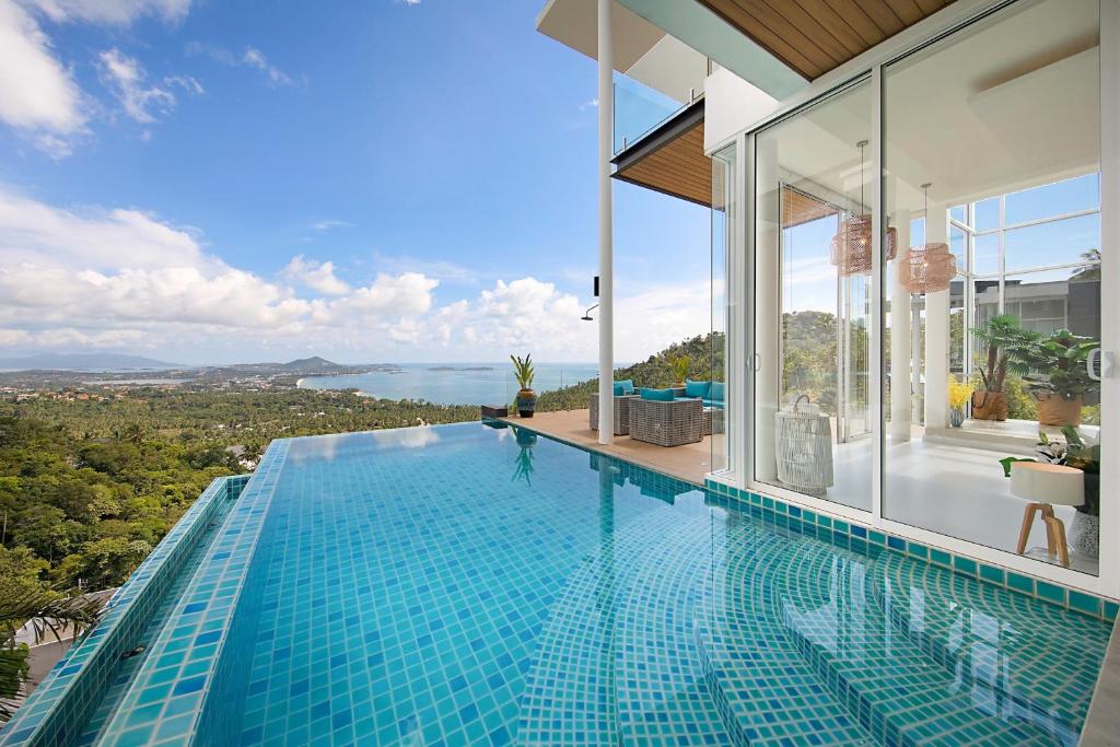 a swimming pool in a house with a view at Stunning Blue Sea Villa 3BDRM Infinity Pool in Chaweng Noi Beach