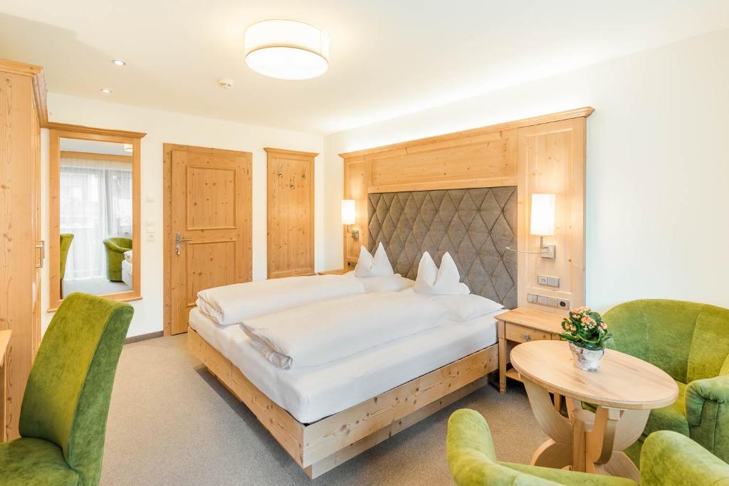 Postel nebo postele na pokoji v ubytování Hotel Pension Sonnleiten