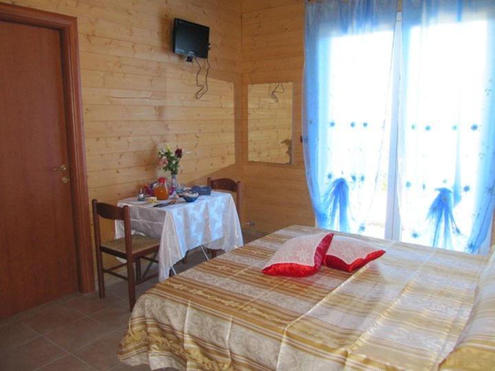 Postel nebo postele na pokoji v ubytování BeB Casa Di Lety
