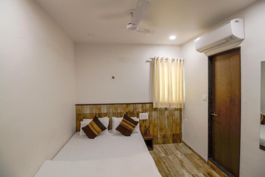 Postel nebo postele na pokoji v ubytování Hotel City Inn
