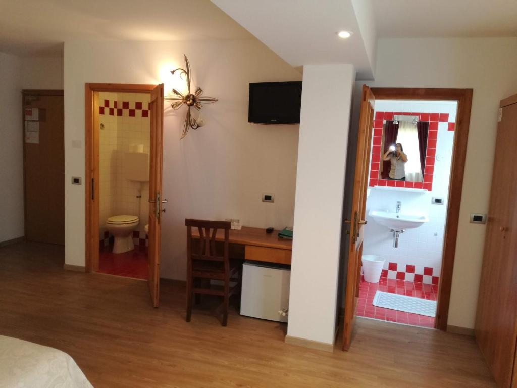 Postel nebo postele na pokoji v ubytování Hotel Orso Grigio