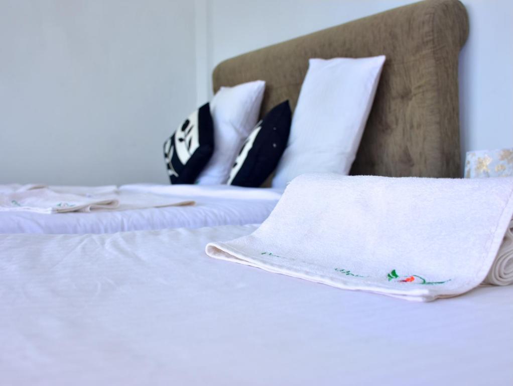 Postel nebo postele na pokoji v ubytování Ornateview Hotel