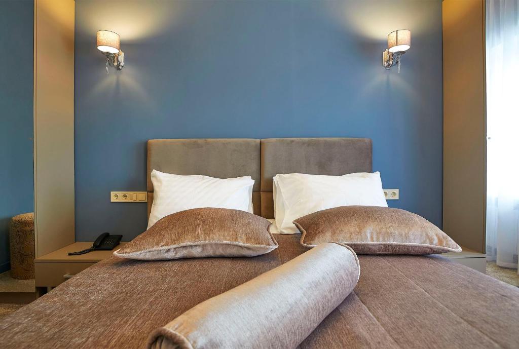 Postel nebo postele na pokoji v ubytování Resort Hotel Karpaty