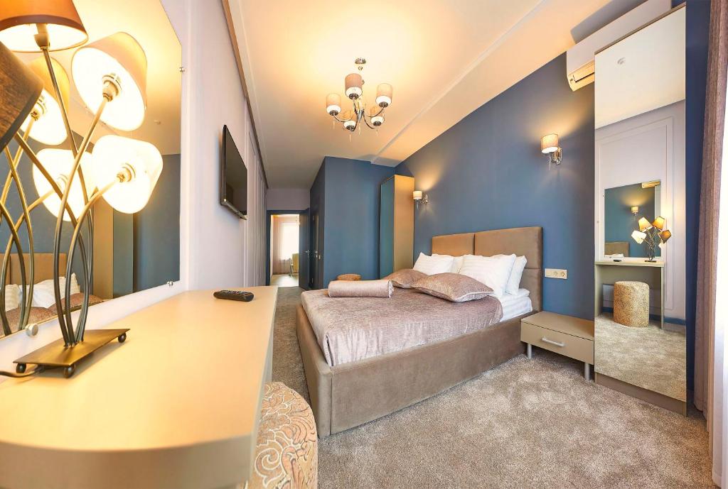 Postel nebo postele na pokoji v ubytování Resort Hotel Karpaty