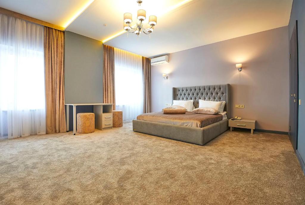 Postel nebo postele na pokoji v ubytování Resort Hotel Karpaty