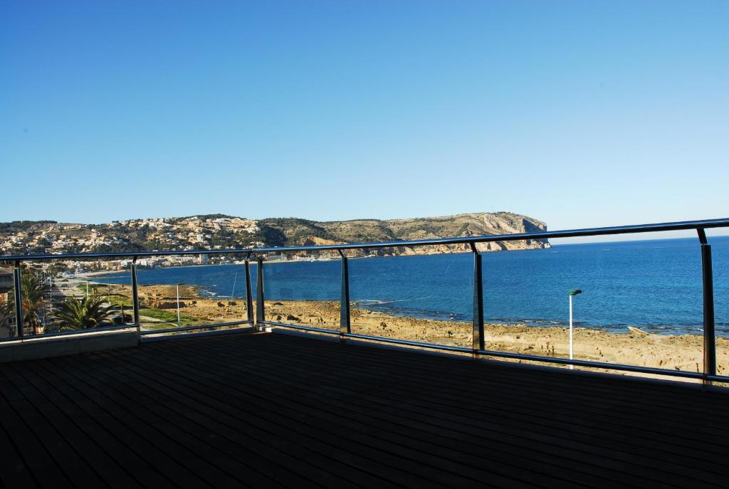 a balcony with a view of the beach at Super Luxury Penthouse in Jávea