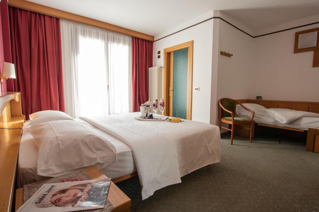 Postel nebo postele na pokoji v ubytování Hotel Santanton