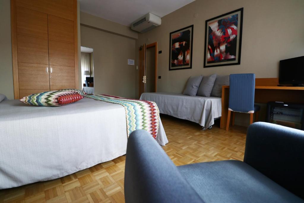 Postel nebo postele na pokoji v ubytování Hotel Clarici