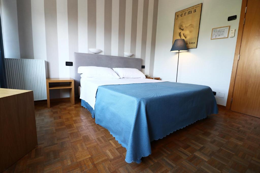 Postel nebo postele na pokoji v ubytování Hotel Clarici