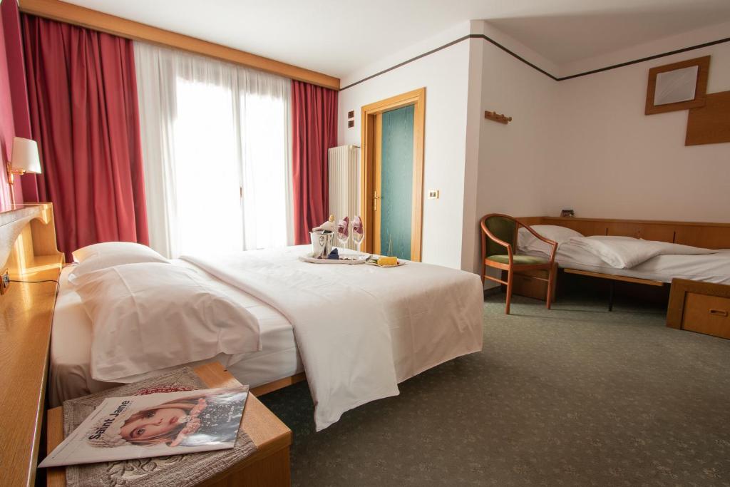 Postel nebo postele na pokoji v ubytování Hotel Santanton