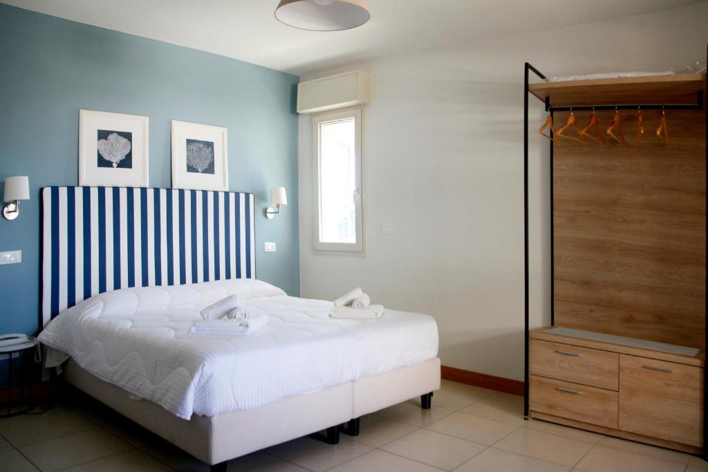 Postel nebo postele na pokoji v ubytování Hotel Majorca sul Mare in centro a Riccione