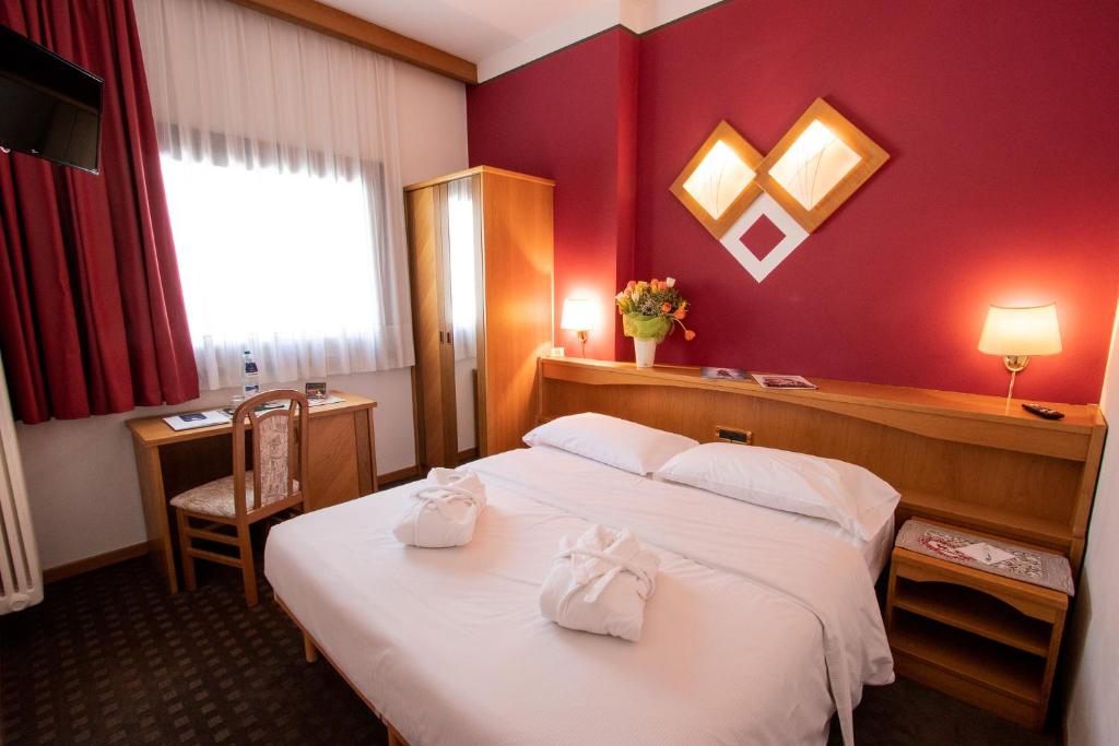 Postel nebo postele na pokoji v ubytování Hotel Santanton