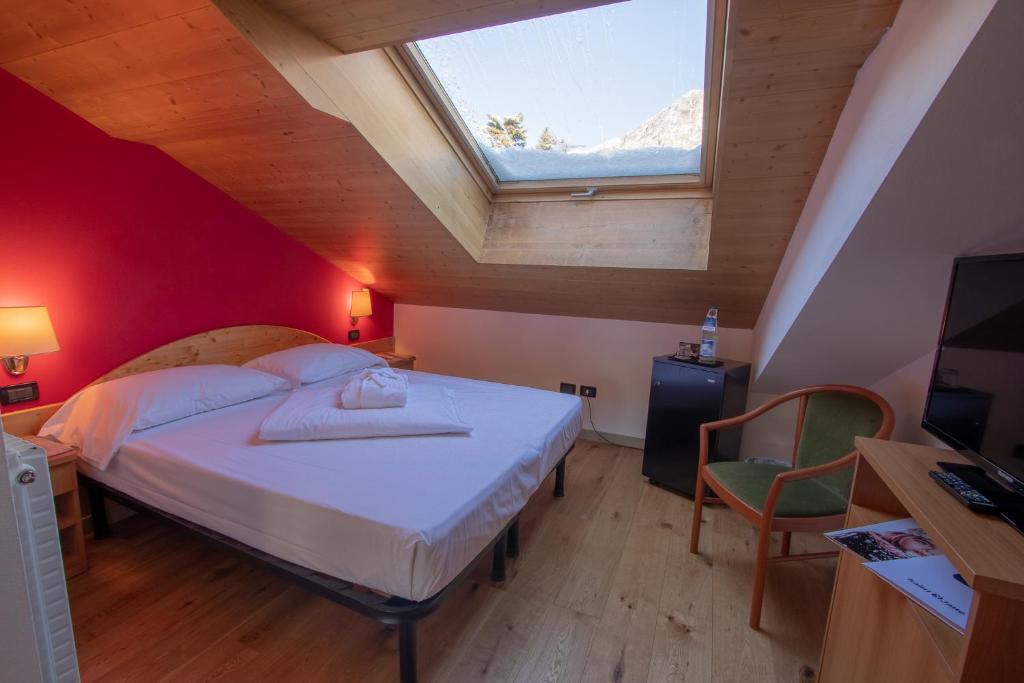 Postel nebo postele na pokoji v ubytování Hotel Santanton