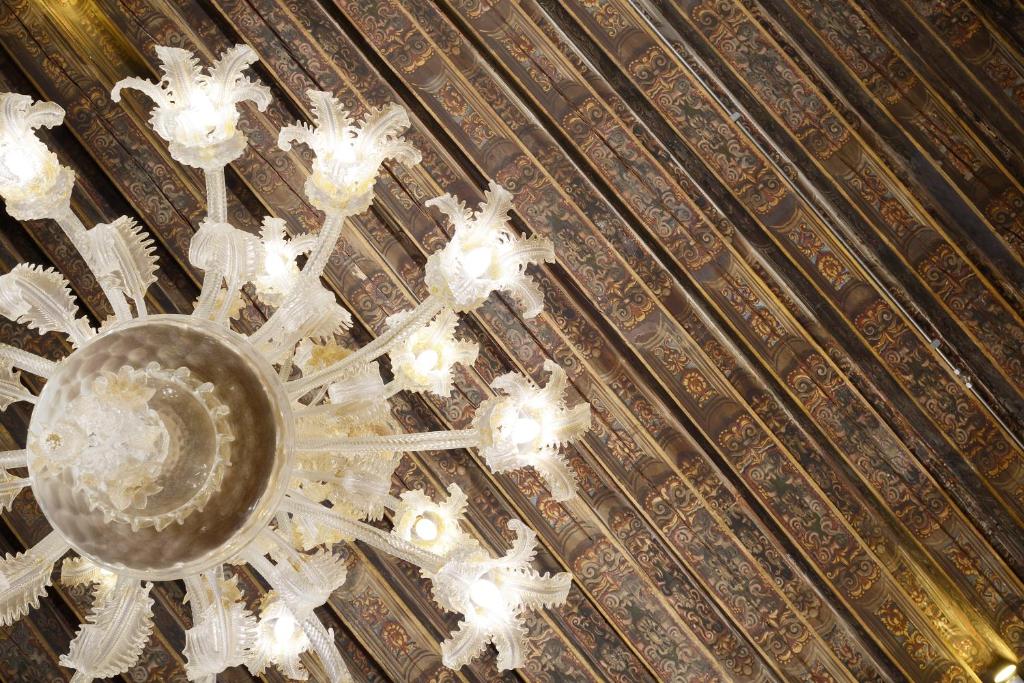 a chandelier hanging from the ceiling of a building at Hotel Palazzo Giovanelli e Gran Canal in Venice