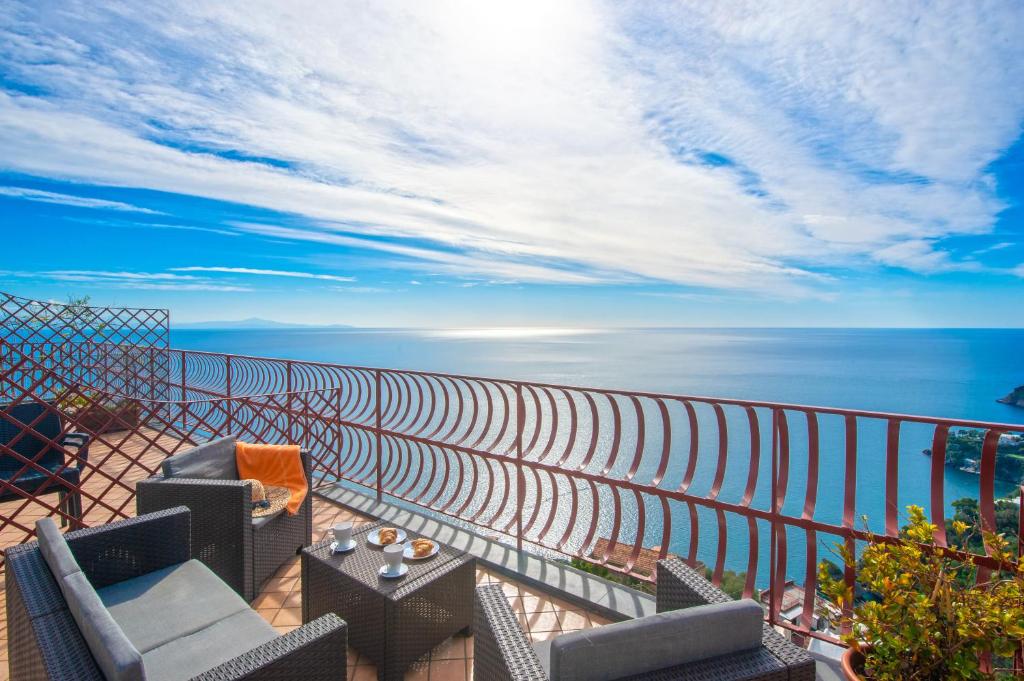 a balcony with a view of the ocean at Harmony in Amalfi